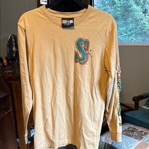 Tan Long Sleeve Shirt with Green S Logo